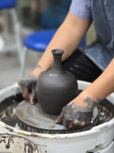 Wheel-Throwing clay at pottery studio