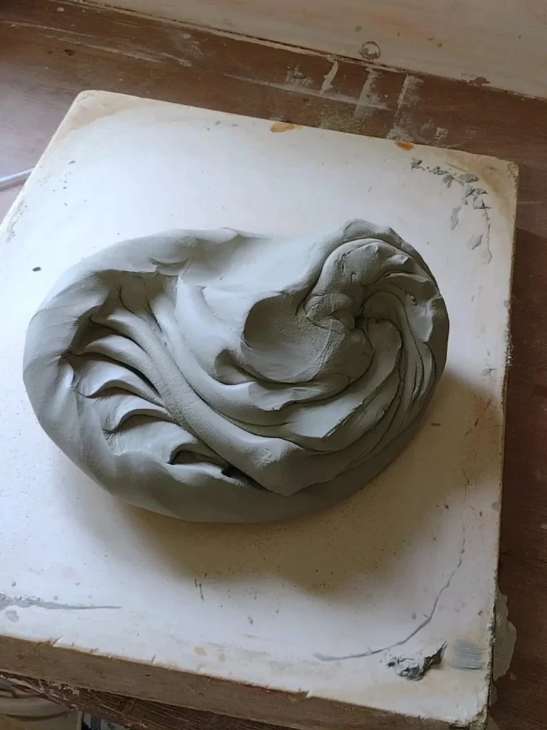 Spiral wedging for pottery wheel