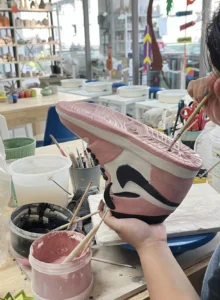 Ceramic sculpture ceramic nike air jordan in Black and red