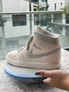 Ceramic sculpture ceramic nike air jordan in Black and red